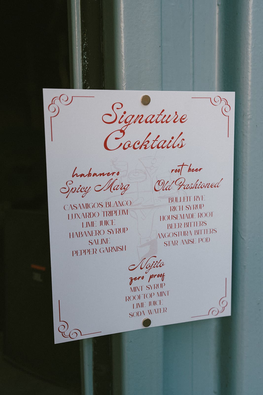 A wedding cocktail sign