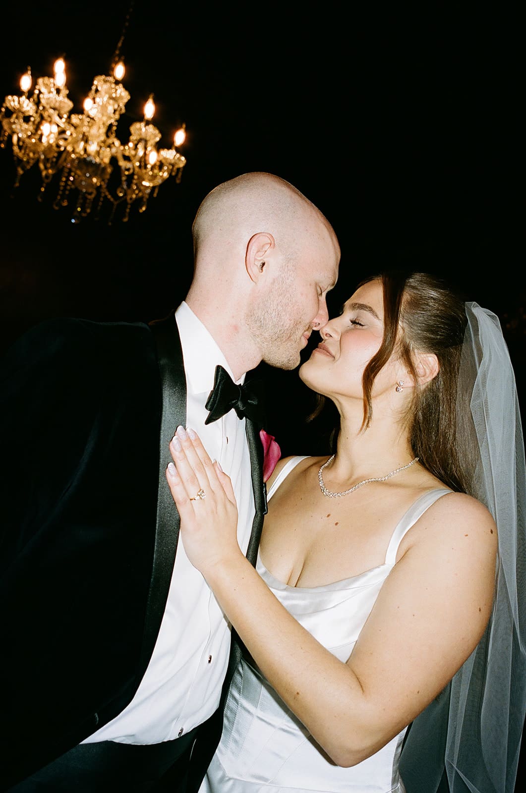 A bride and groom posing for editorial wedding photos
