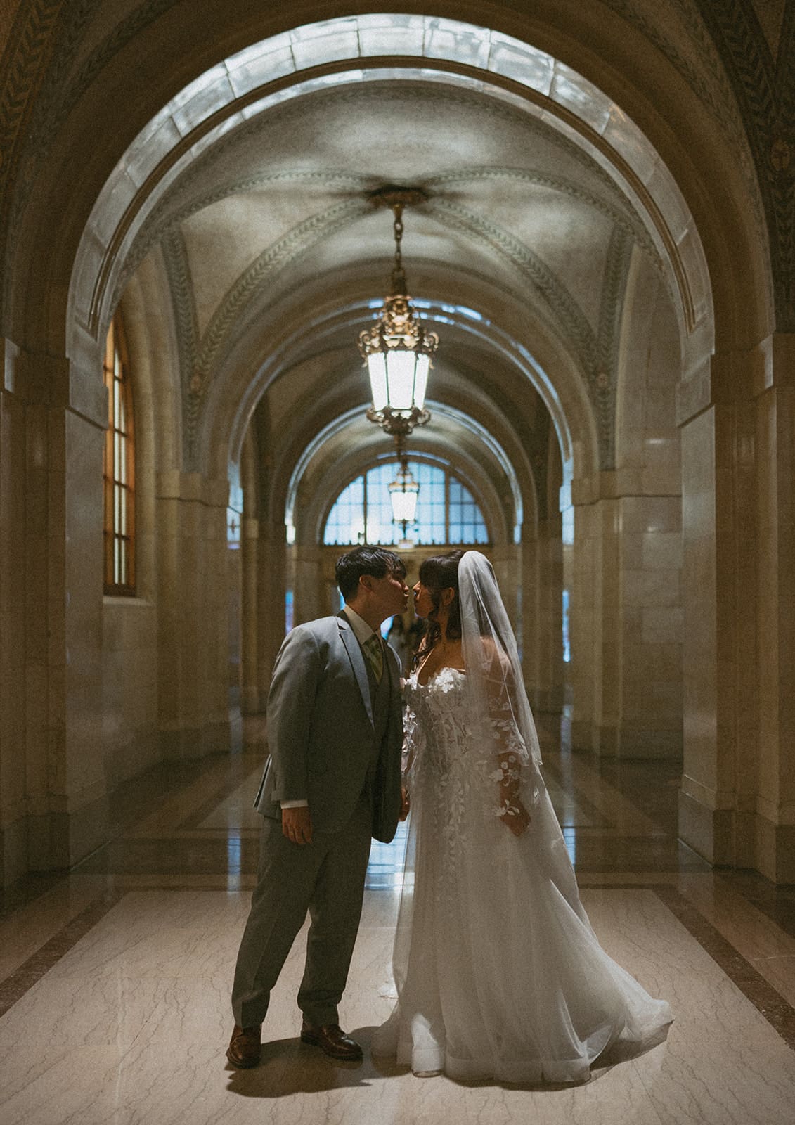 A bride and groom taking courthouse wedding photos