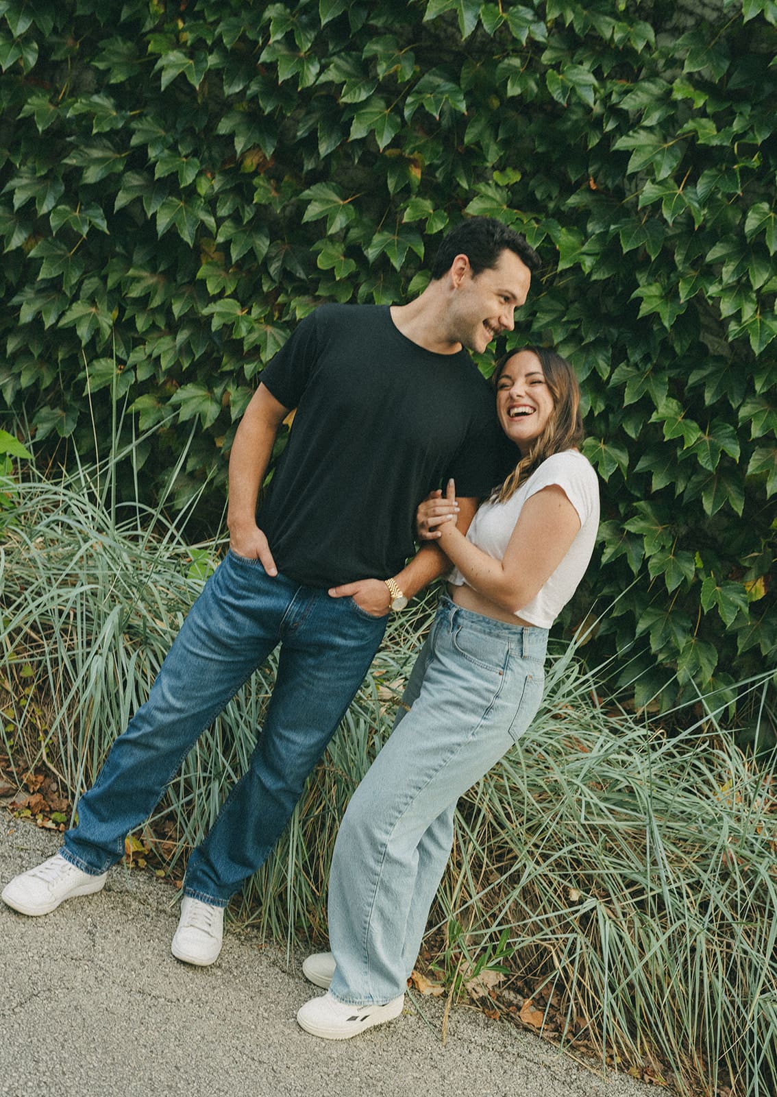 A couple posing for summer engagement photos, showing when to take engagement photos