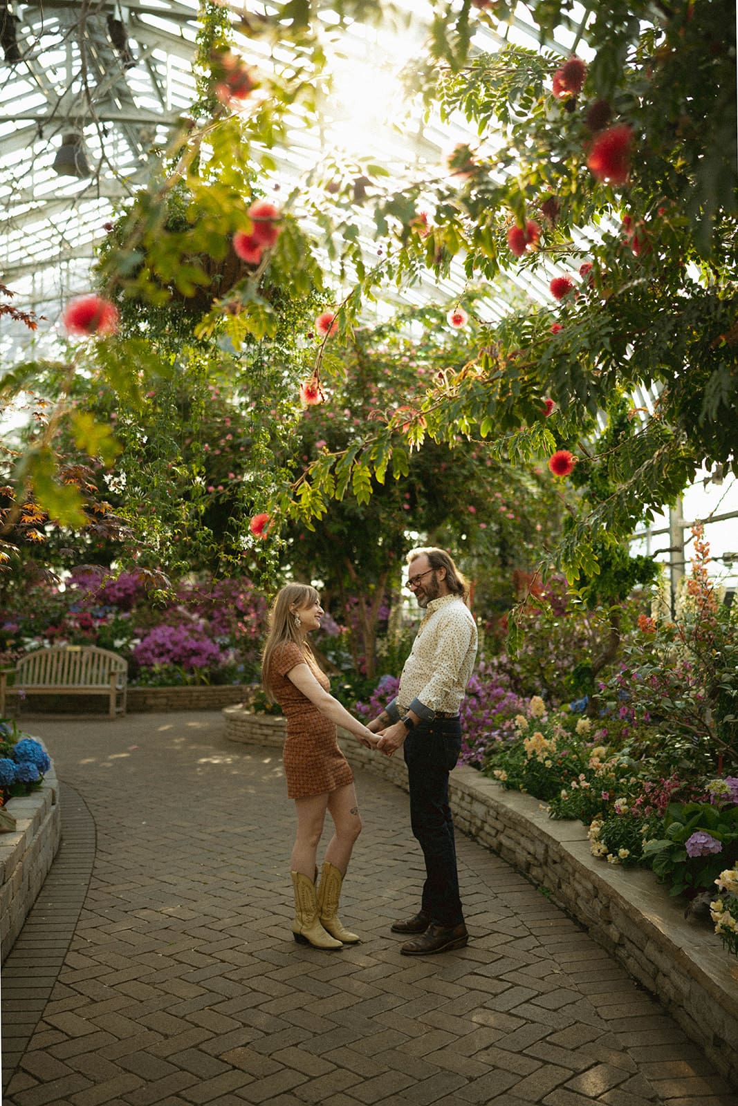 A couple posing for spring engagement photos, showing when to take engagement photos