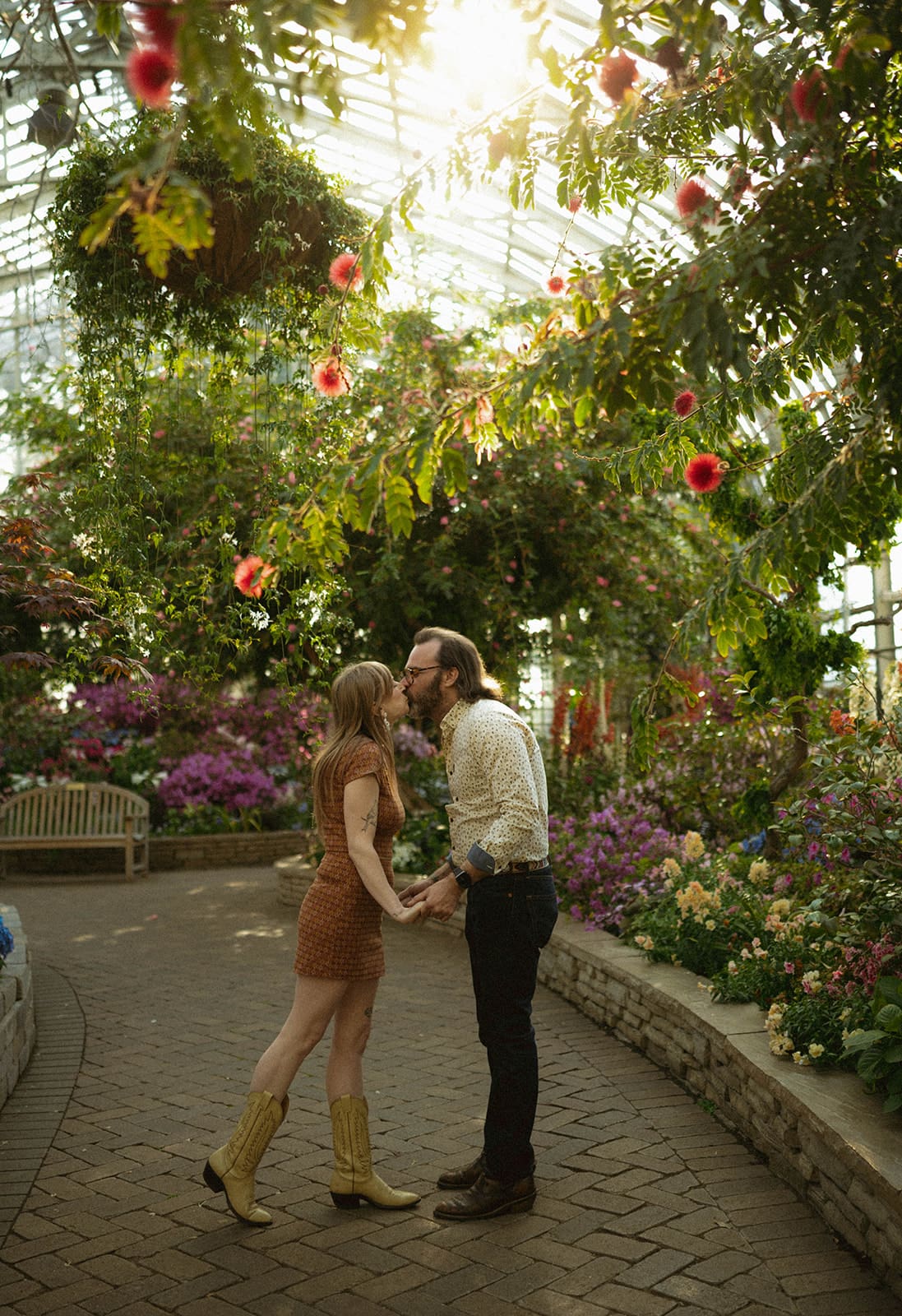 A couple posing for spring engagement photos, showing when to take engagement photos