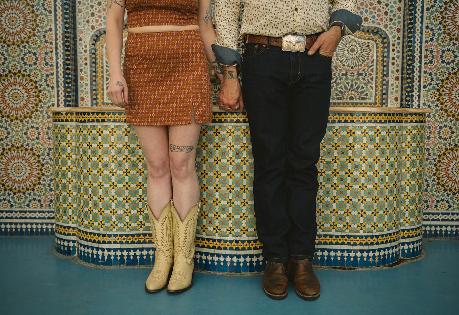 A couple posing for spring engagement photos at the garfield park conservatory