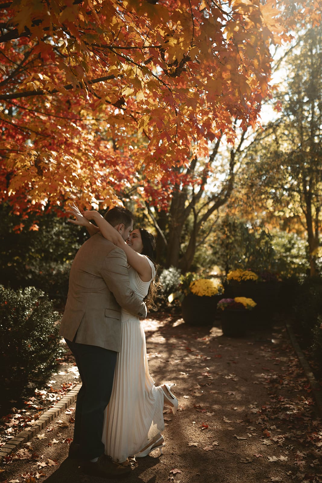 A couple taking fall engagement photos in Chicago, showing when to take engagement photos