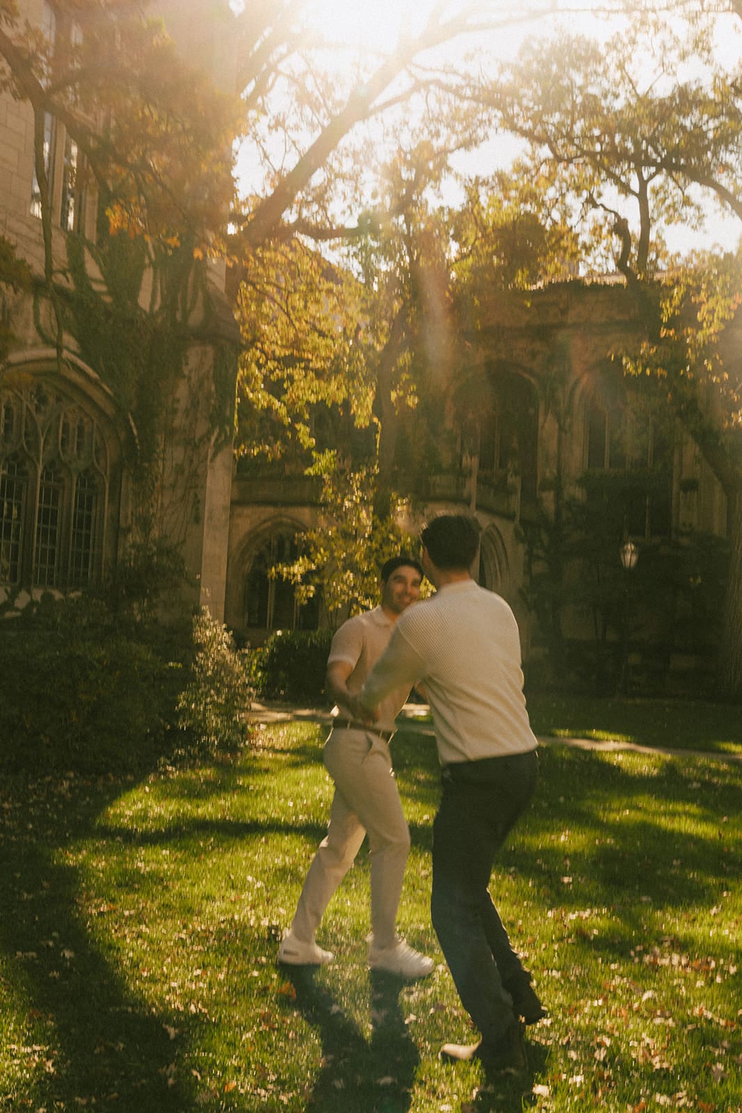 A couple spinning for engagement photos at sunset