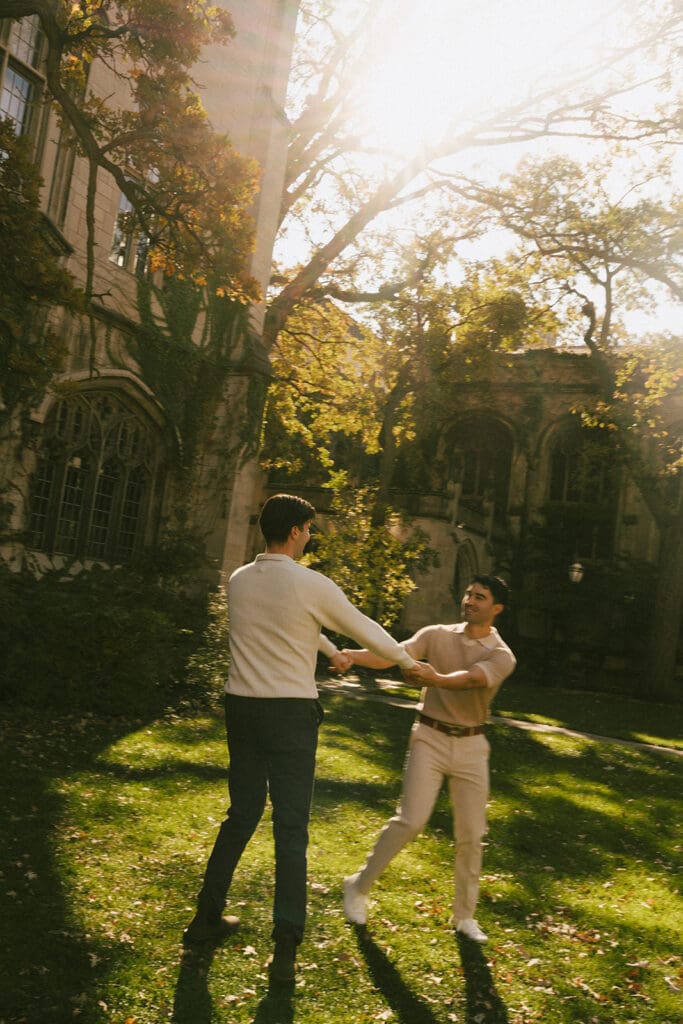 A couple spinning for engagement photos at sunset