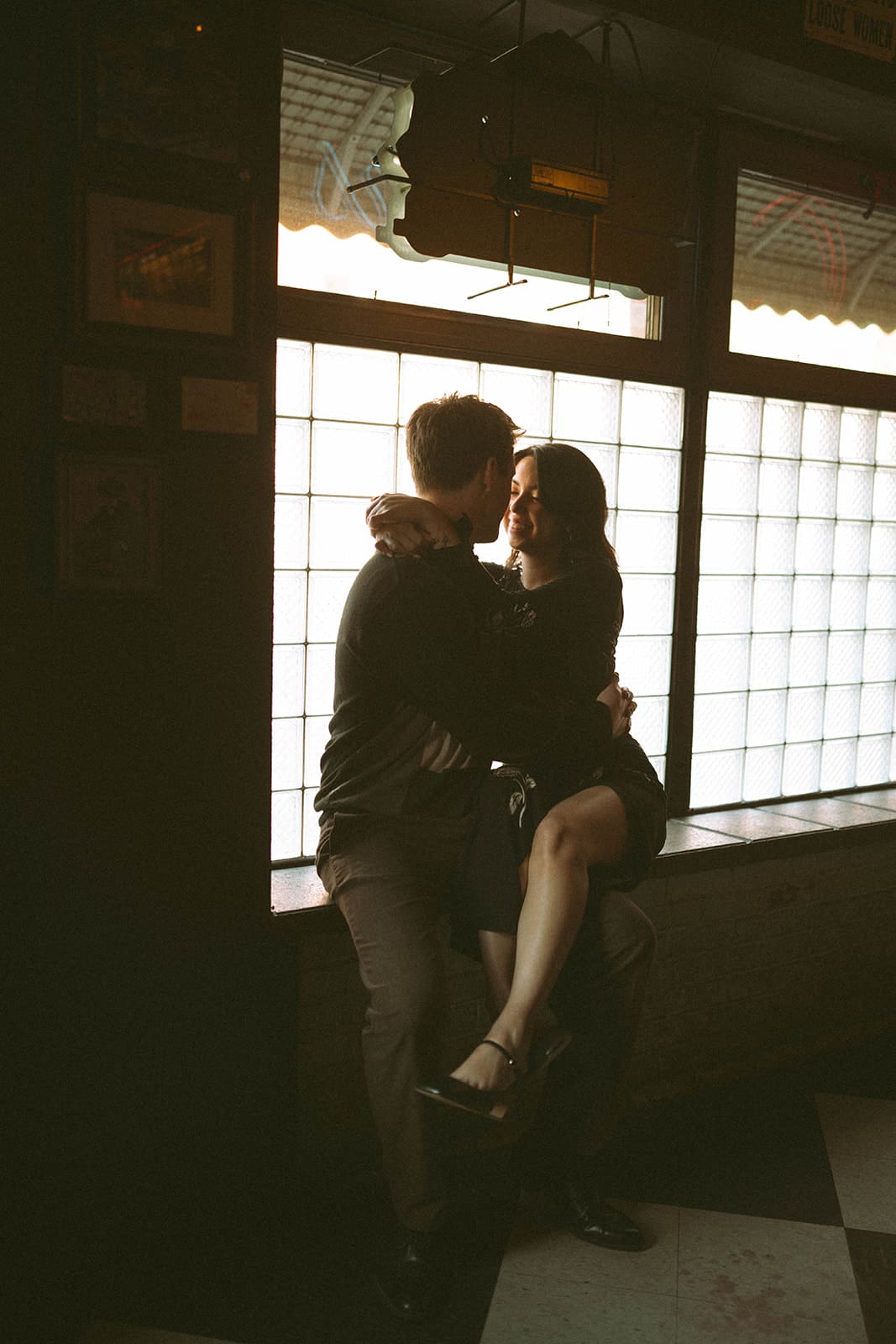 A couple posing for winter engagement photos in Chicago
