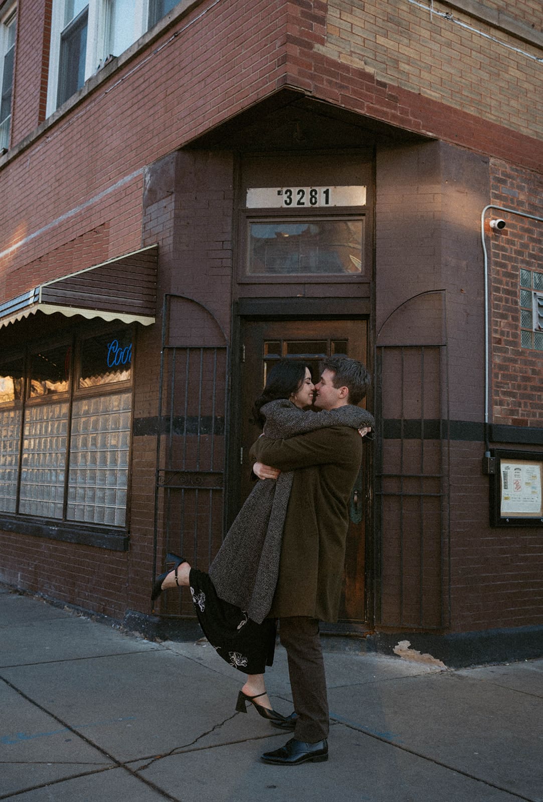 A couple posing for winter engagement photos in Chicago