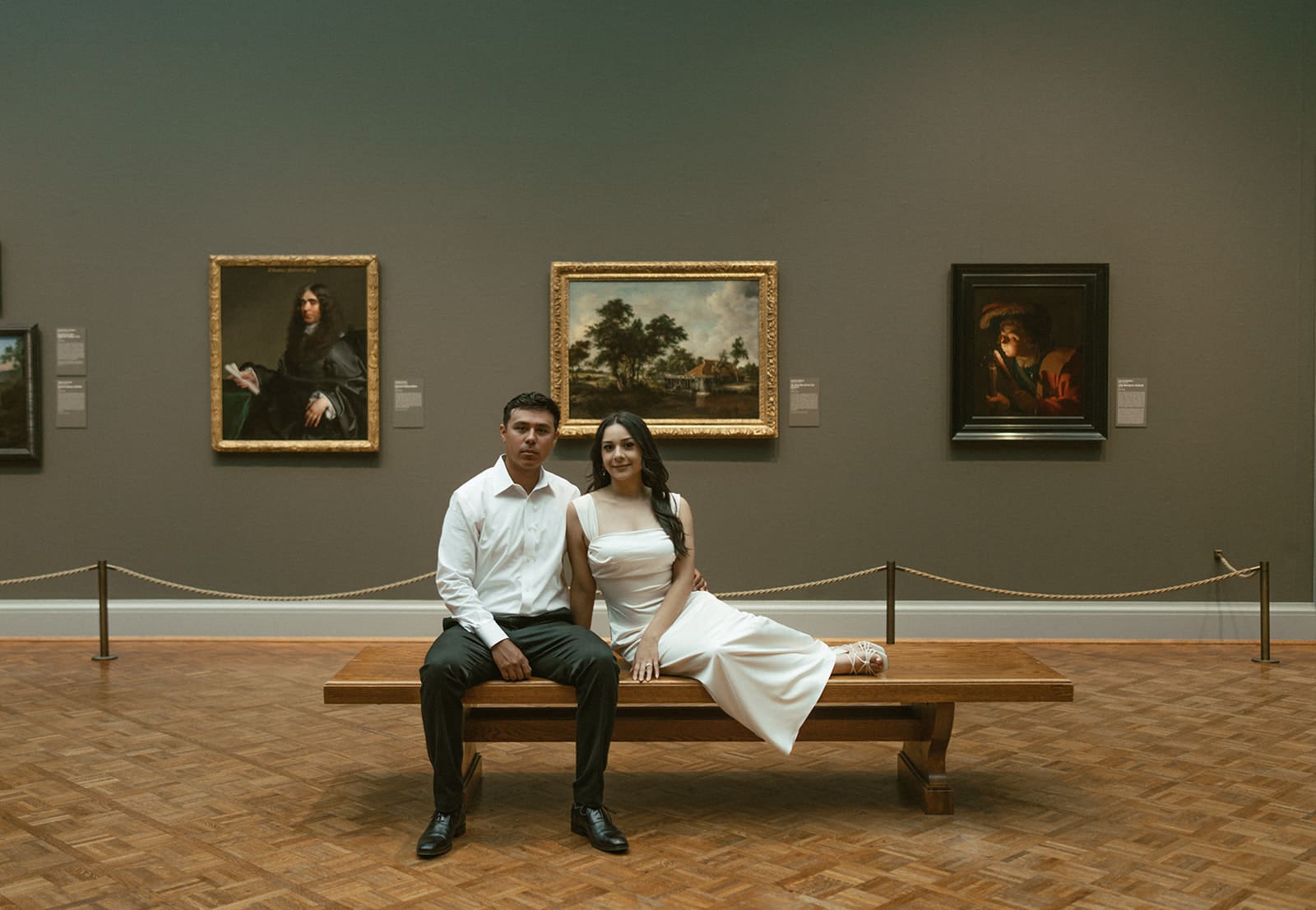 A couple who chose the art museum as their engagement photoshoot location