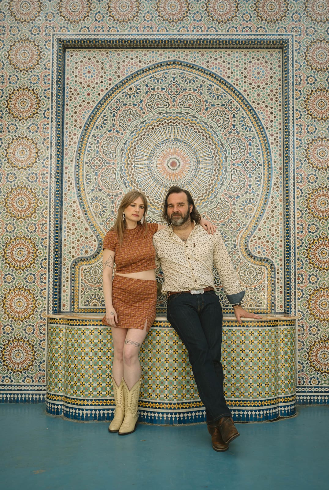 A couple at a unique engagement photoshoot location