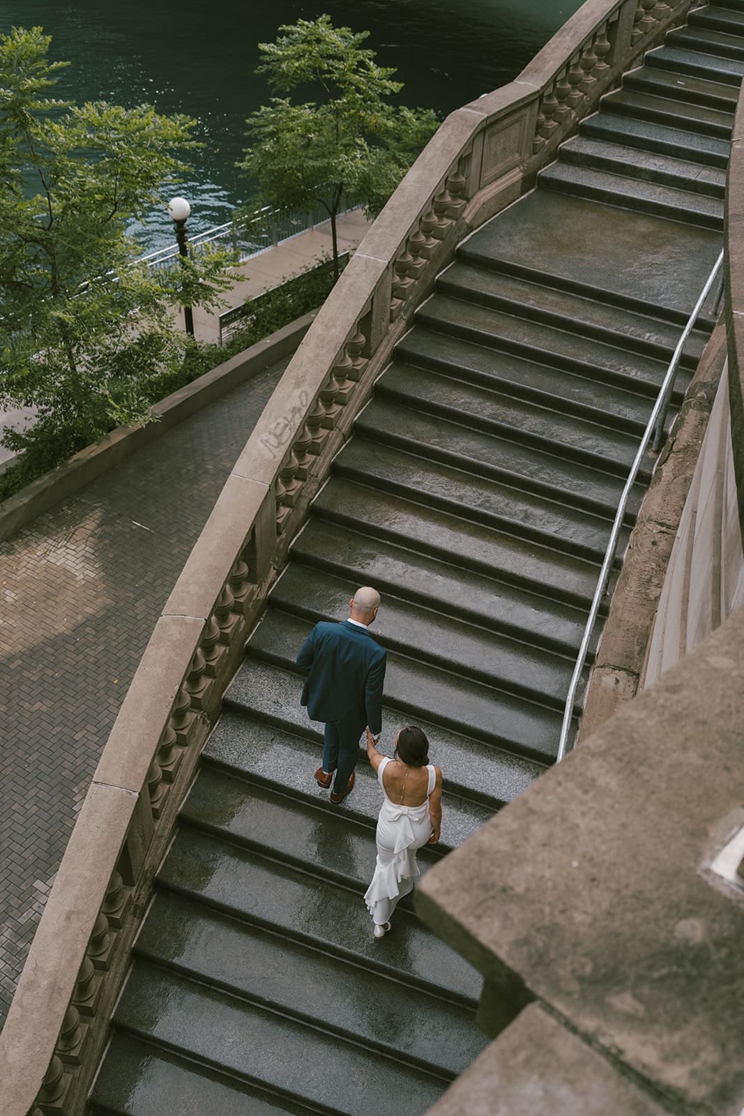 A couple taking engagement photos on Chicago Riverwalk
