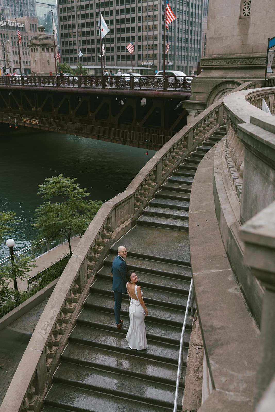 A couple taking engagement photos on Chicago Riverwalk