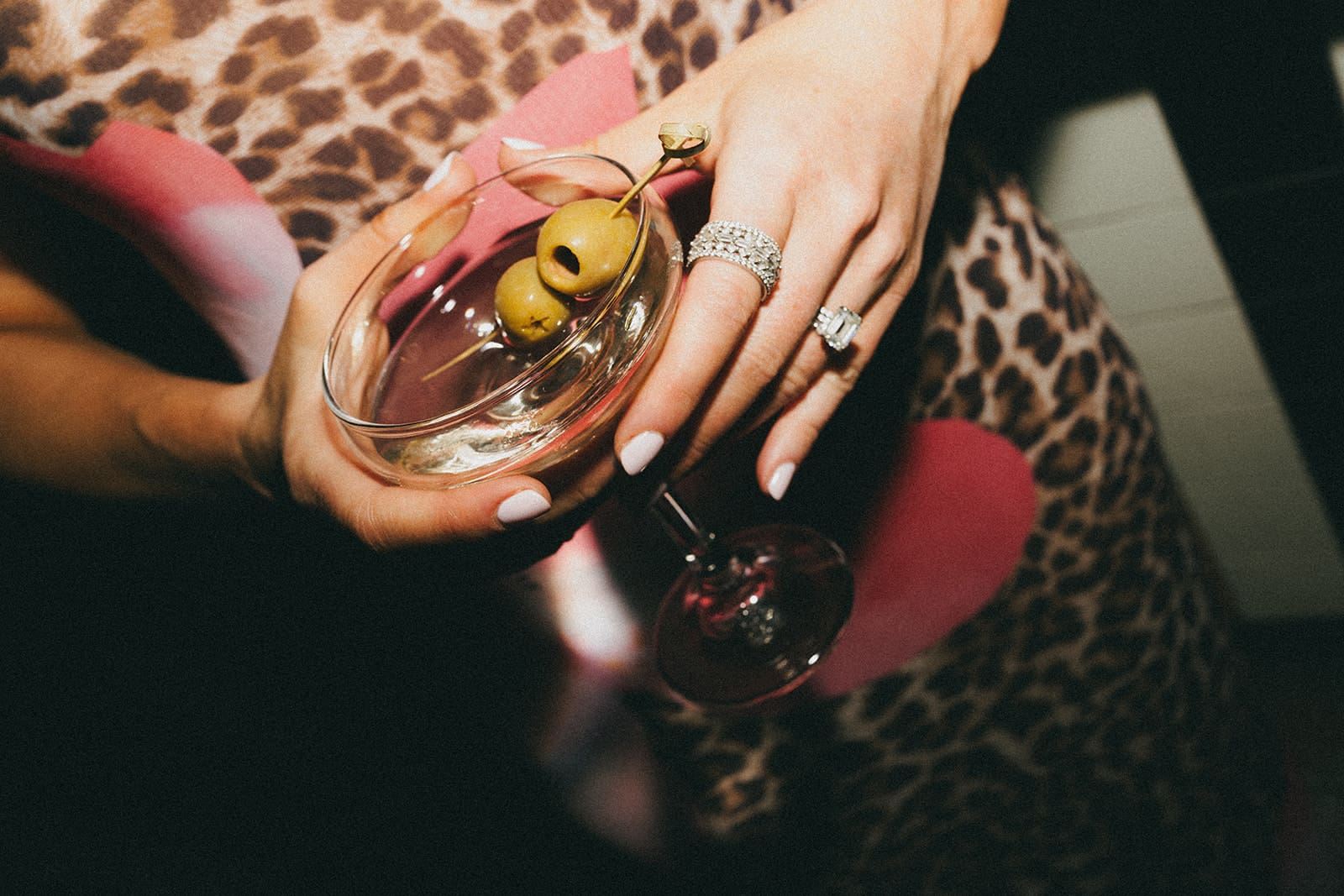 A wedding guest with a martini 