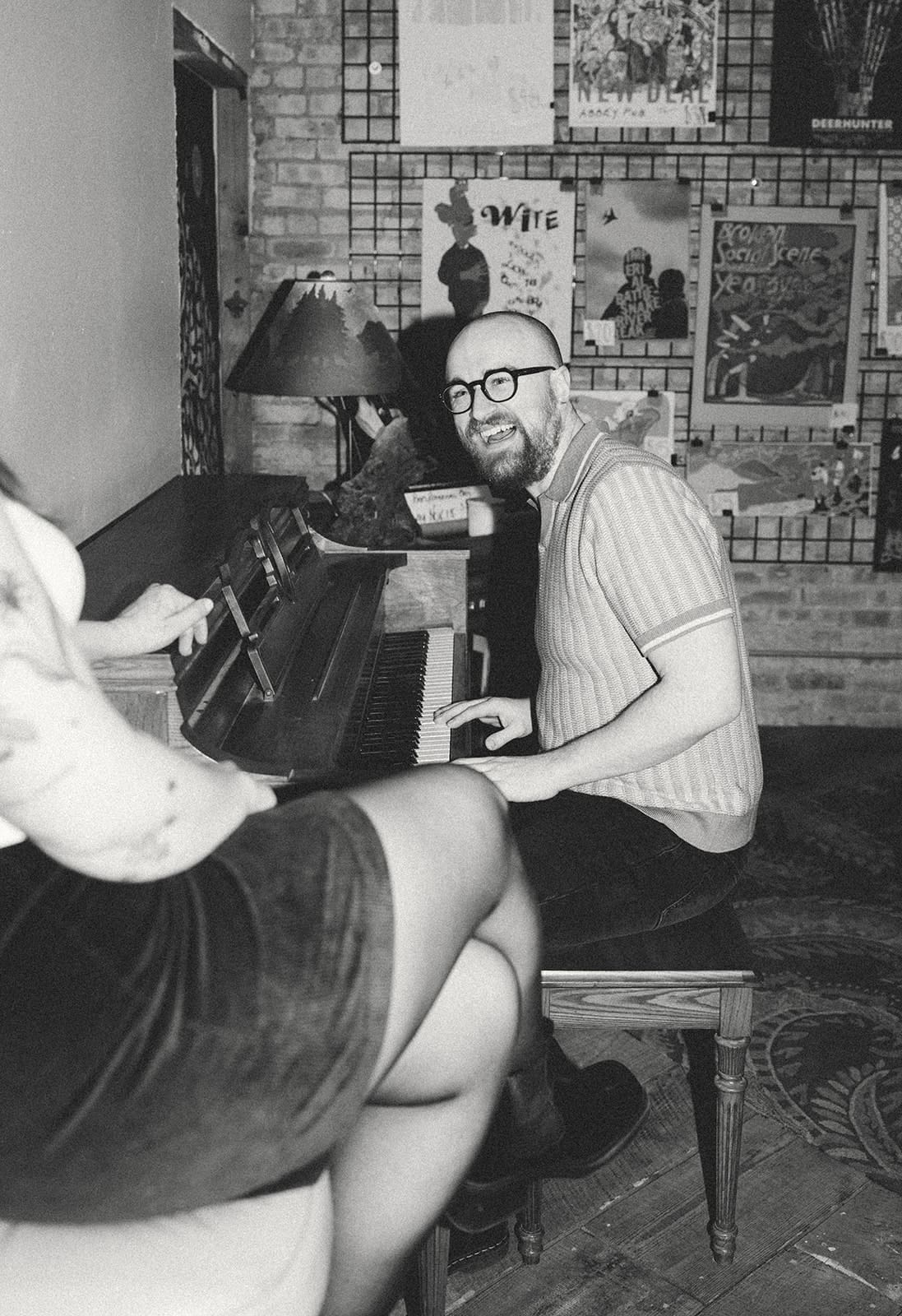 A man playing piano during record store engagement photos