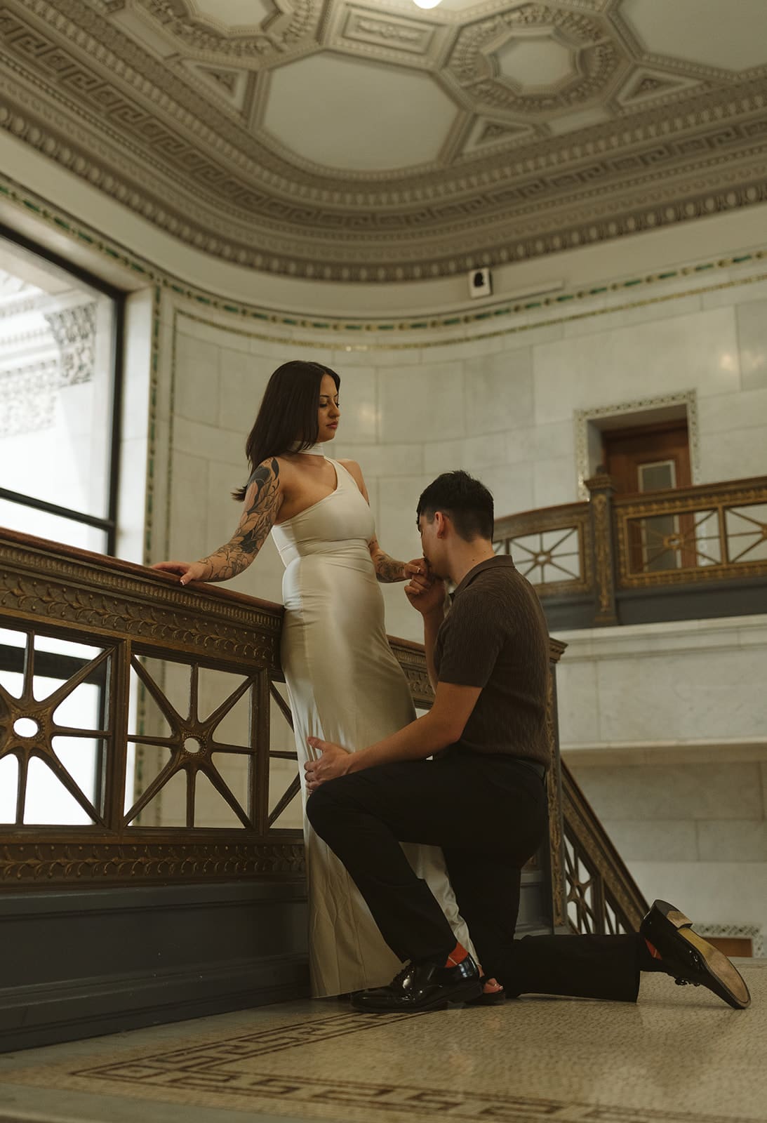 A couple posing for engagement photos as a part of their wedding planning timeline