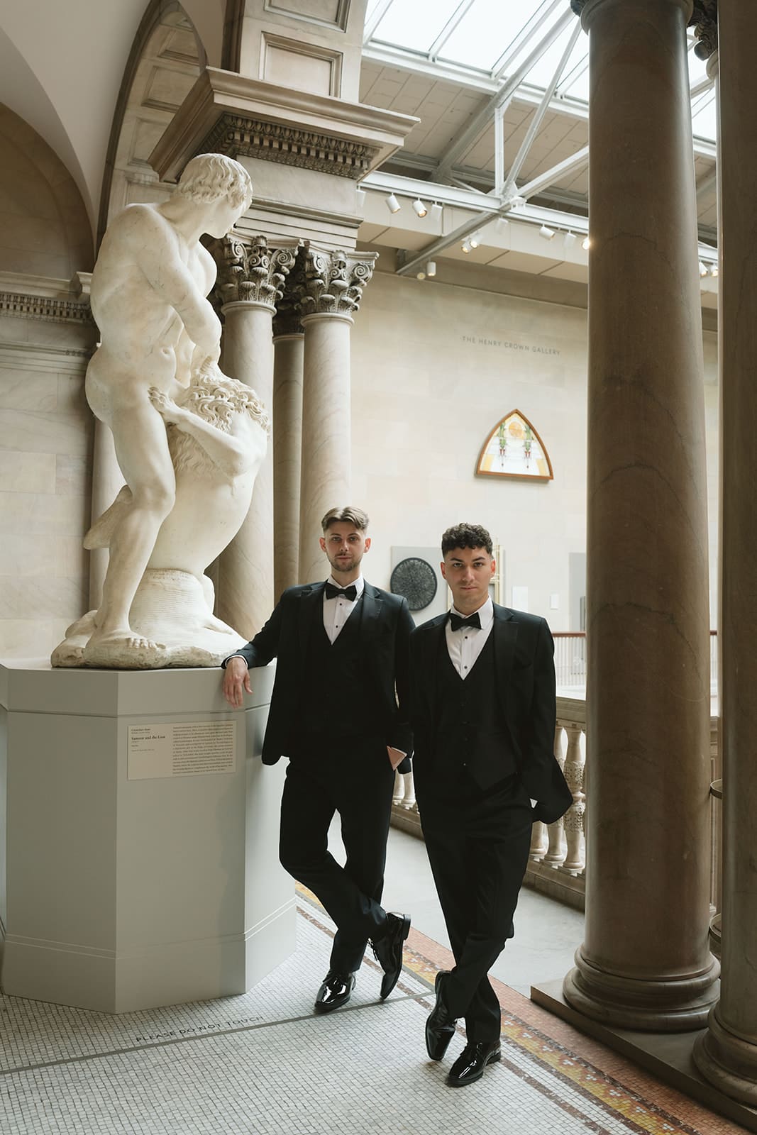 Two grooms taking wedding photos in the Chicago aRt Museum