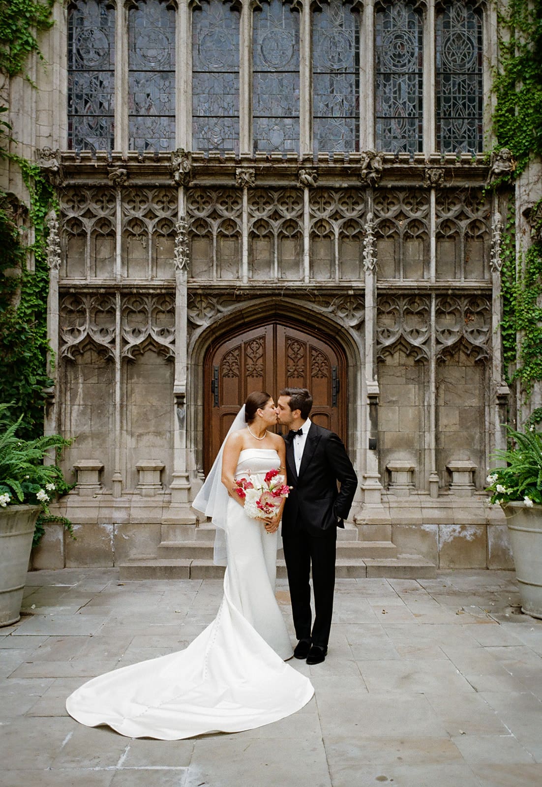 A bride and groom posing for wedding photos