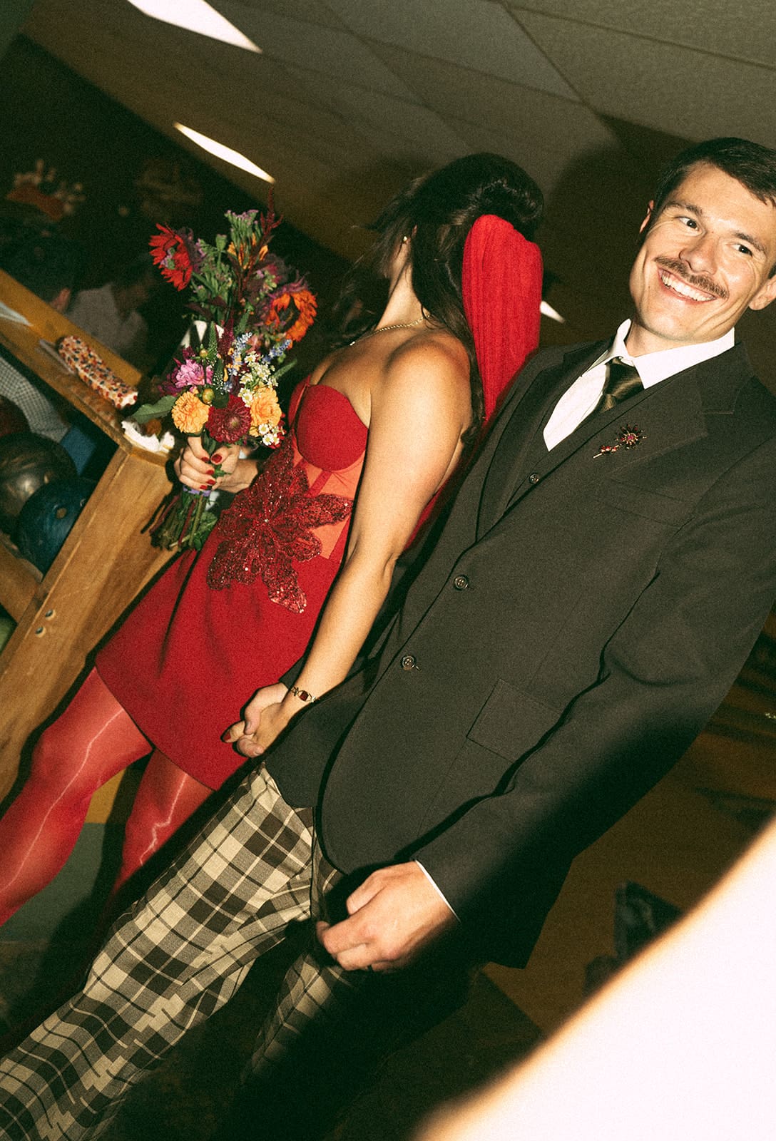 A bride and groom's funky wedding outfits