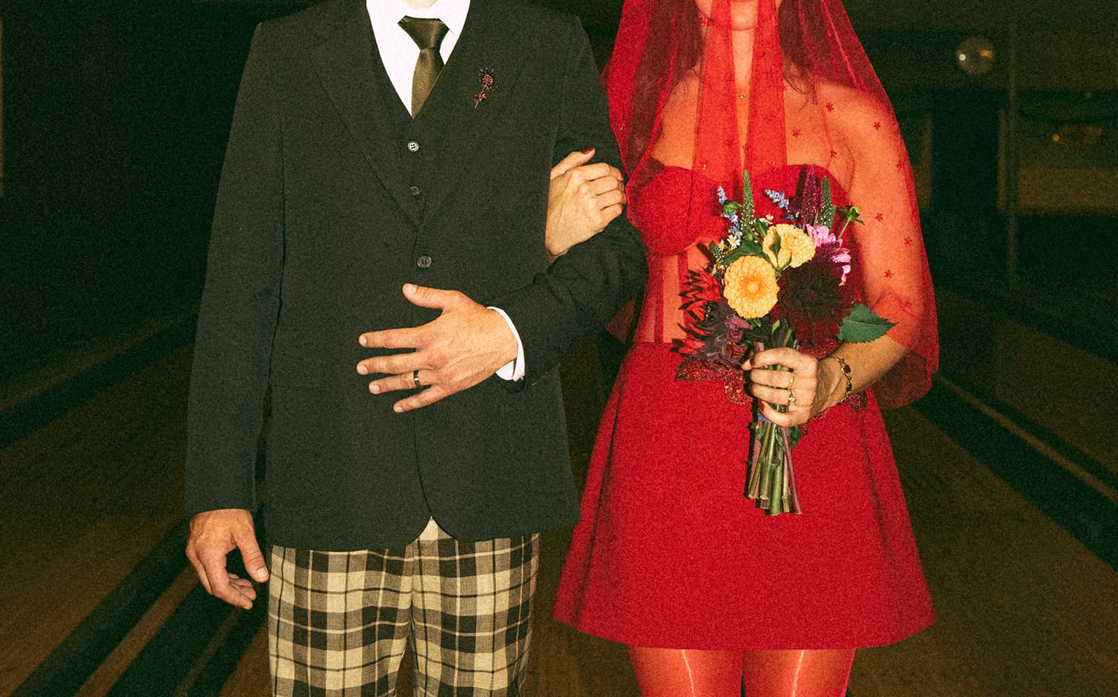 A bride and groom's funky wedding outfits