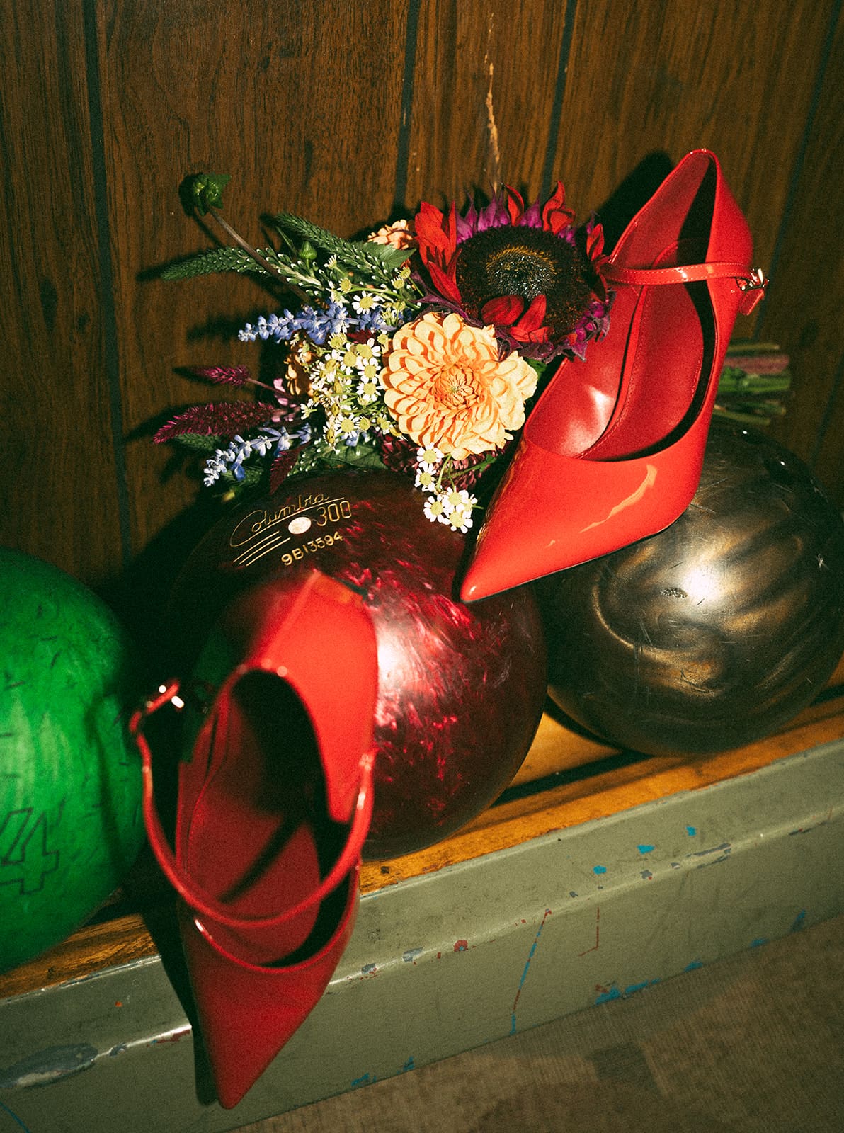 A flat lay from a bowling alley wedding