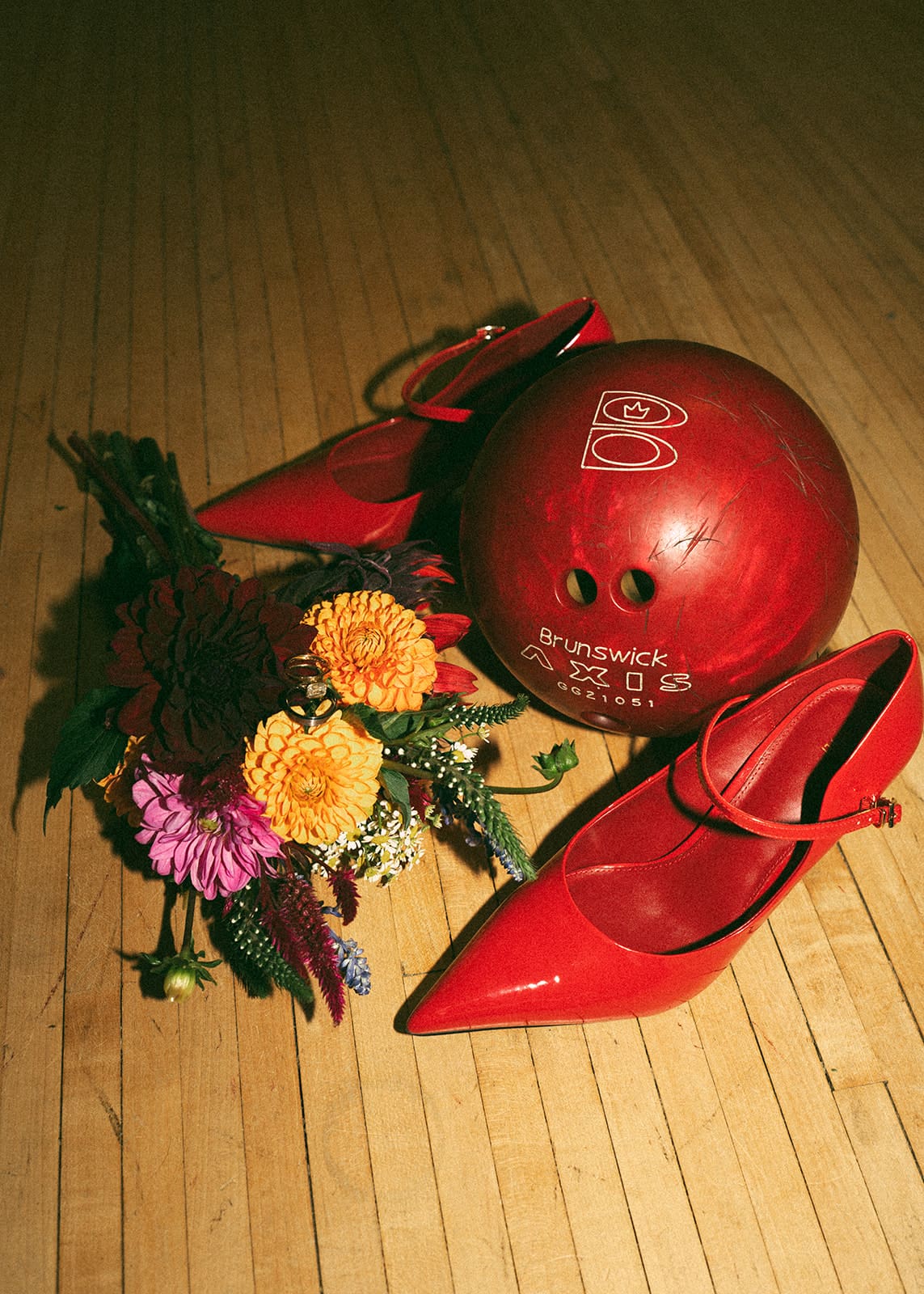 A flat lay from a bowling alley wedding