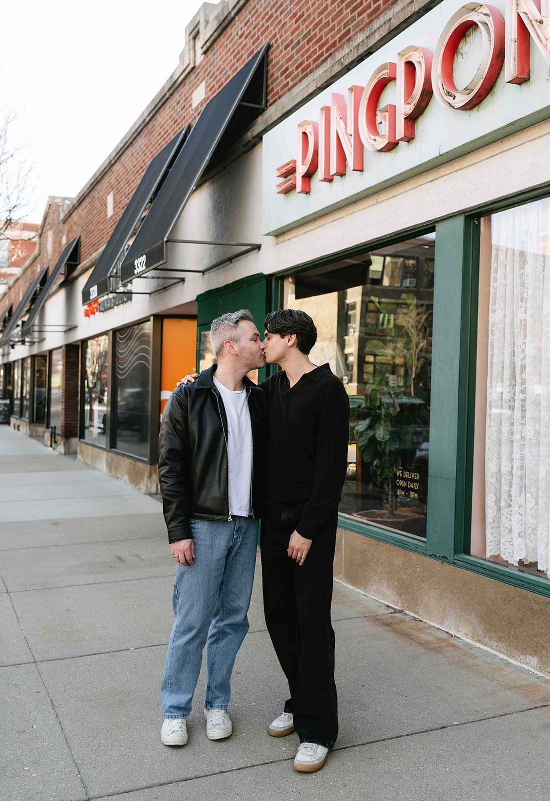 A couple kissing during their Lakeview Chicago engagement photos